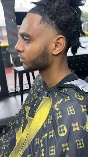 Skin fade with textured top, side profile